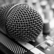 a microphone on a sound mixing board